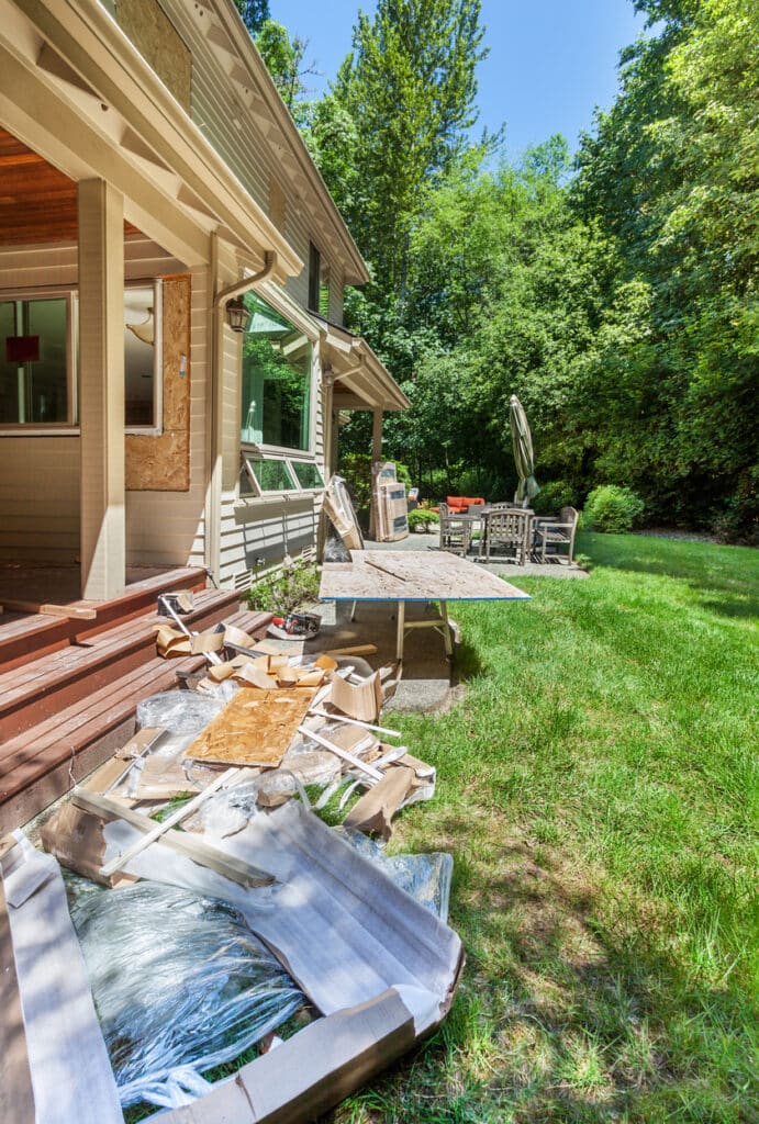 Window installation during home addition remodel with back garden as staging area